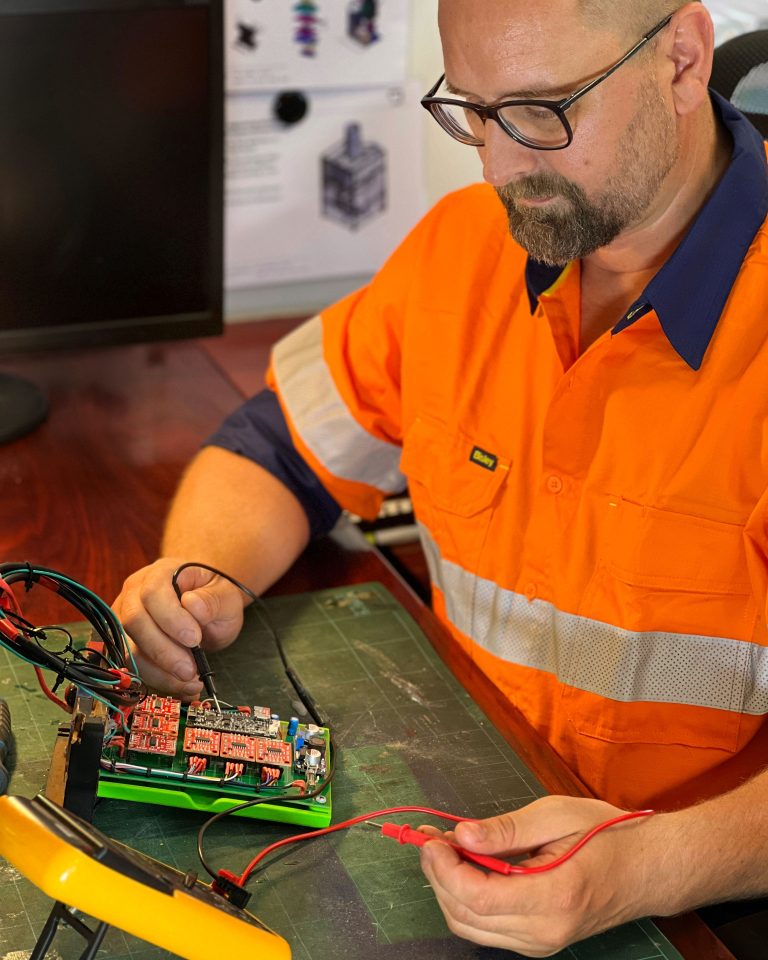 Michael Brigmann testing electronics in the workshop